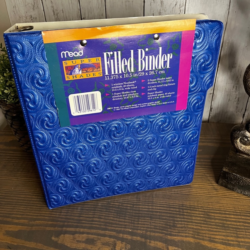 Vintage 1990s Mead Filled Binder with pastel blue paper.